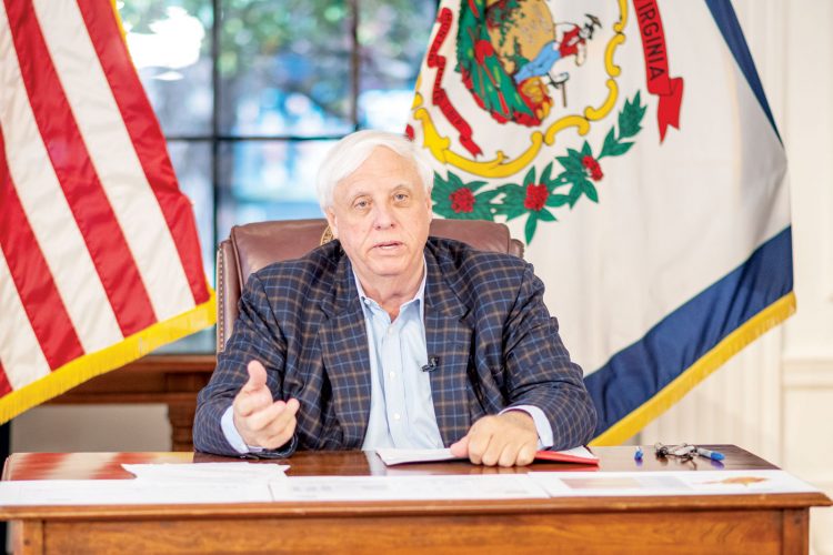 Justice touts boosters as vaccinated hospitalizations see rise